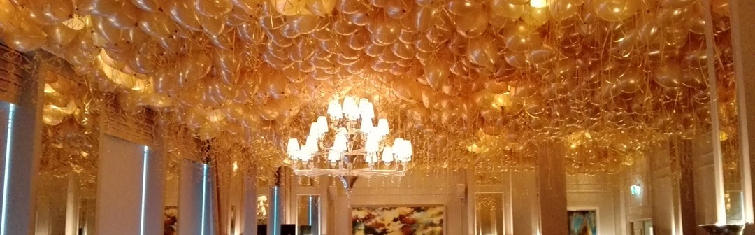 ballonnen tegen plafond Amsterdam goud